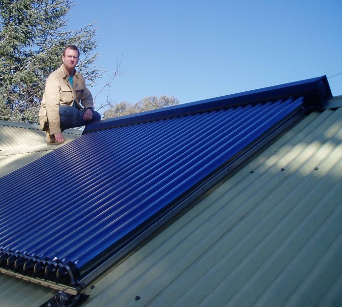 Mike on the roof with his solar hot water system